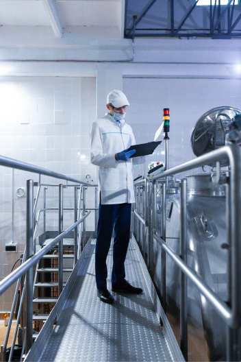 Inspector in a mask on Granja Verde factory